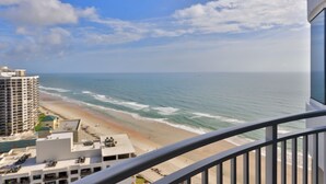 A balcony with a view of the beach and ocean. - SAND CASTLE-Amazing Ocean Views,  Pool & HotTub PeckPlaza 23NW (Daytona Beach)