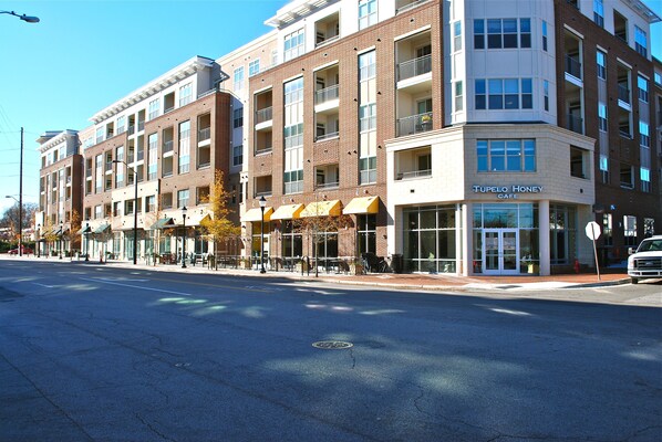 A multi-story building with a cafe named "Tupelo Honey Cafe" on the ground floor.