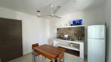 Full-size fridge, microwave, blender, cookware/dishes/utensils