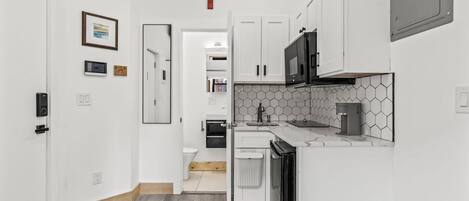 Microwave, stovetop, dishwasher, coffee/tea maker