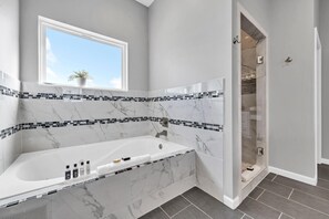 Jetted bath, hair dryer, towels, soap
