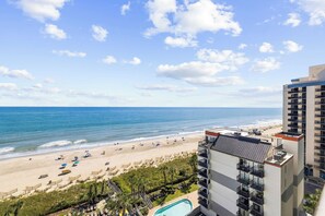 A hotel with a pool, beach view, and multiple balconies. - Family Oceanfront Condo Located in North end of Myrtle Beach! (Myrtle Beach)
