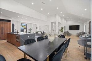 Open concept living area with dimmable lighting to set the mood for any occasion