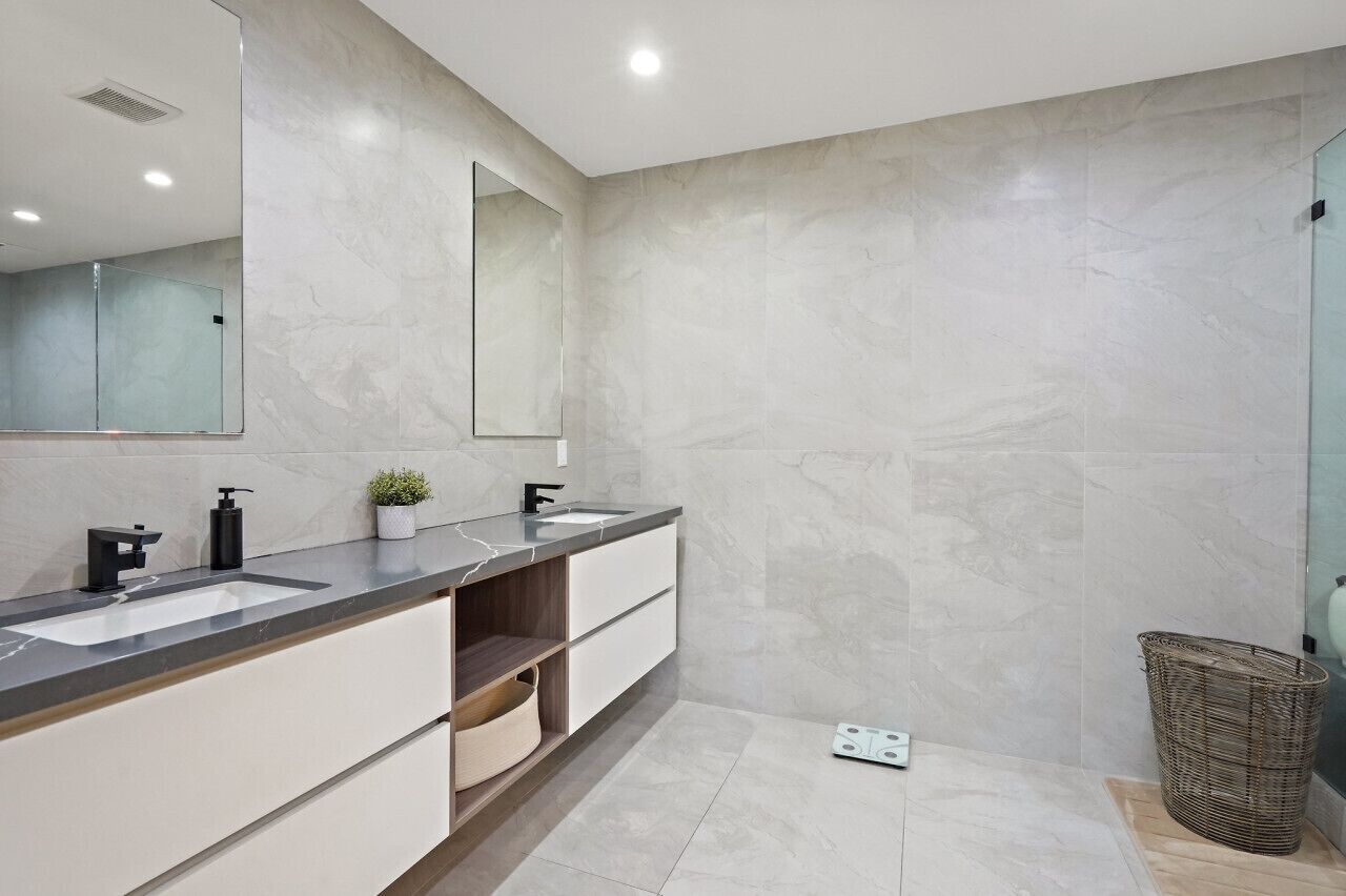 Bathroom 1: Ensuite to primary bedroom, marble counters, dual vanity & separate toilet area