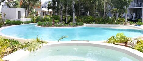 Outdoor pool, open 9:00 AM to 10:00 PM, pool loungers