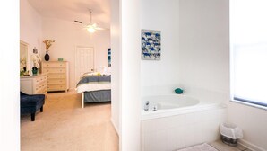 A bedroom with a bed, dresser, and a ceiling fan. - Free Pool Heat & Spacious Pool Deck | Themed Bedrooms | Near Disney (Kissimmee)