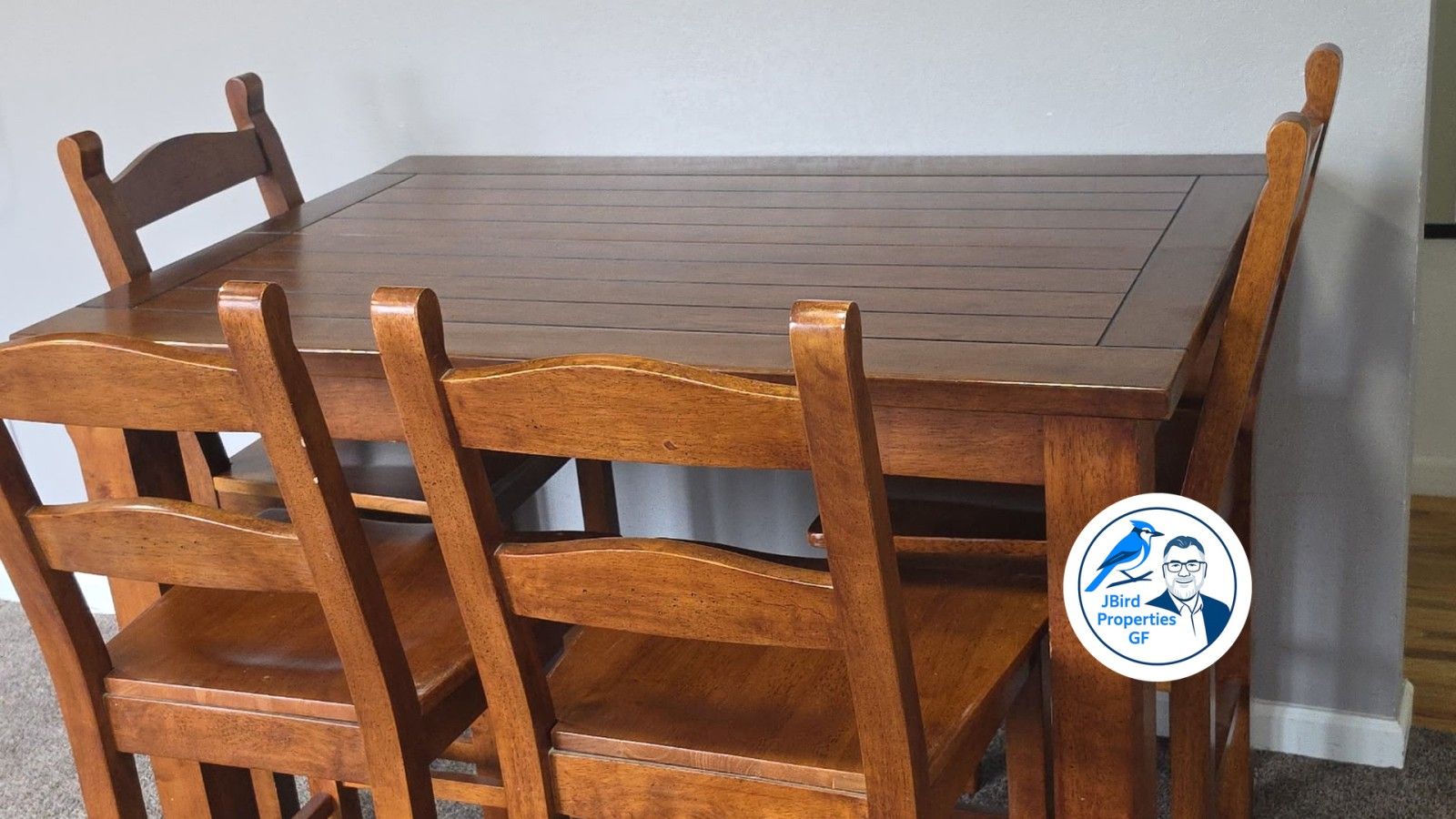 A wooden dining table with six chairs.
