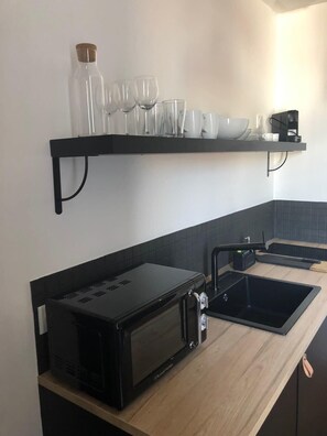 Fridge, microwave, stovetop, coffee/tea maker