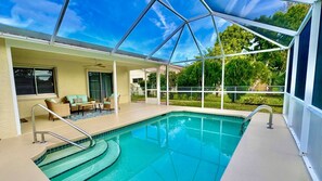 Outdoor pool, a heated pool - BEAUTIFUL Pool Home Near Beach FALL ๐ SPECIALS! โ๏ธ๐๏ธ๐ (Vero Beach)