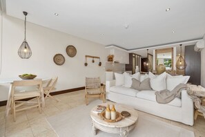 Luxury Apartment | Living area | 32-inch Smart TV with cable channels