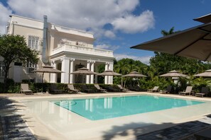 Outdoor pool, open 7:00 AM to 7:00 PM, pool umbrellas, pool loungers