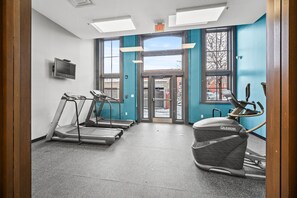 Stay active with our fully equipped fitness center featuring treadmills, elliptical machines, and a TV for entertainment.