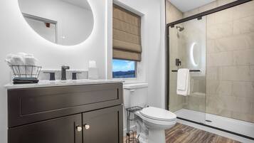 Shower, eco-friendly toiletries, hair dryer, towels