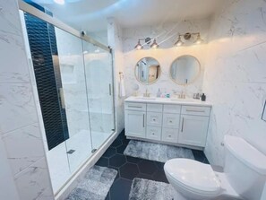 Shower, hair dryer, towels, soap