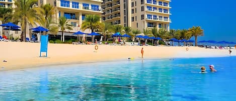 On the beach, sun-loungers, beach towels