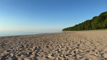 On the beach, sun loungers, beach towels