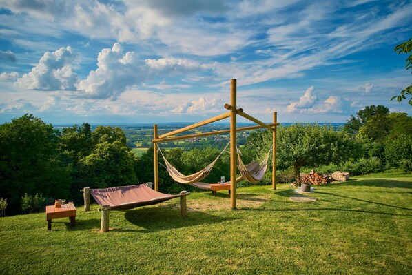 A hammock setup on a grassy hill with a view of the landscape. - Vineyard House Marijan w/ Panoramic Views, Ljutomer, Slovenia (Ljutomer)