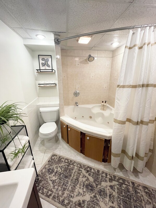 Jetted tub, hair dryer, towels, soap