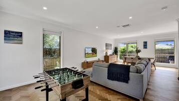 Smart TV, DVD player, foosball, books