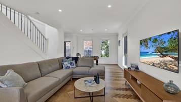 Smart TV, DVD player, foosball, books