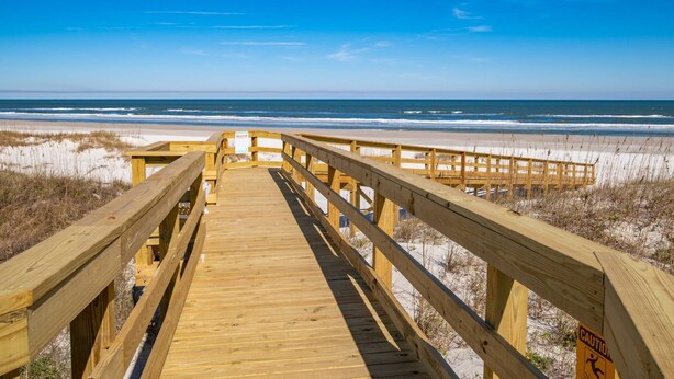A wooden boardwalk leading to a beach with a clear view of the ocean. - Stunning Ocean Views, Beachfront Pool, Heated Indoor Pool, Hot Tub, Family Condo, Tennis, Gym, Sauna (St. Augustine)