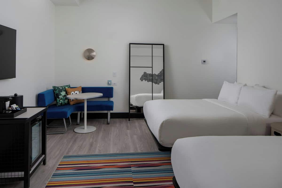 Premium bedding, pillowtop beds, laptop workspace, blackout drapes