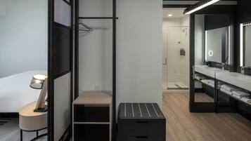 Shower, designer toiletries, hair dryer, towels