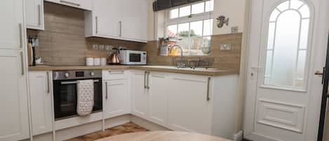 Fridge, electric kettle, toaster, cookware/dishes/utensils