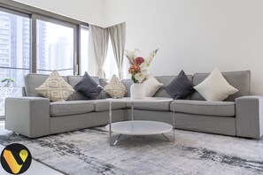 Elite Apartment | Living area | 65-inch Smart TV with cable channels - Burj Crown Burja Khalifa Foutain Views (Dubai)