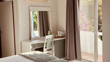 Standard Double or Twin Room | In-room safe, desk, laptop workspace, blackout drapes