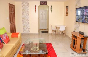 Business Apartment | Living area | 24-inch Smart TV with digital channels
