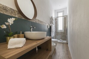 Shower, eco-friendly toiletries, hair dryer, bidet