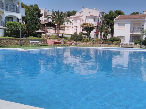 Apartment in Peniscola with pool, tennis court, and playground
