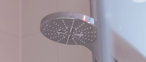 A showerhead with multiple spray nozzles mounted on a vertical pipe.