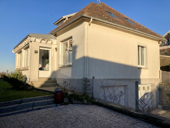A two-story building with a white facade, a tiled roof, and a small front porch. - Les pénates, near beach, picturesque village (Veules-les-Roses)