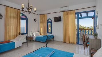 Habitación cuádruple | Cunas gratuitas, wifi gratis y ropa de cama