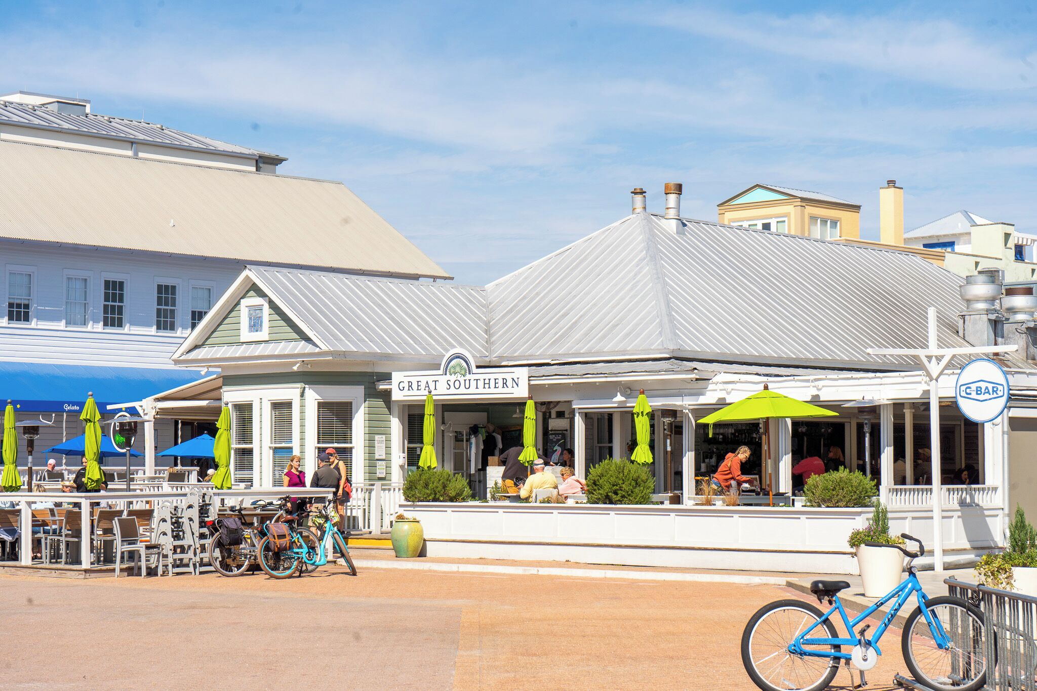 A restaurant named "Great Southern" with outdoor seating, umbrellas, and a bicycle parked outside.