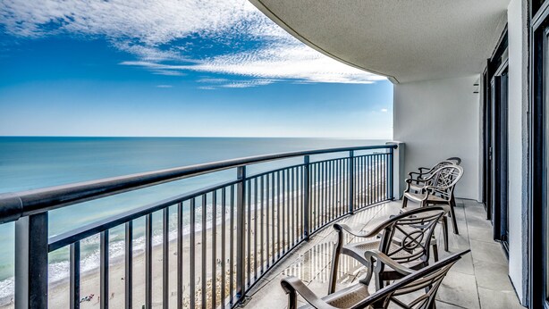A balcony with a view of the ocean, metal railings, and wicker chairs. - 💎Oceanfront~Lazy River~Awesome Amenities~Breakers Resort 1870💎 (Myrtle Beach)