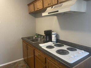 Fridge, microwave, stovetop, coffee/tea maker