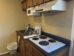 Fridge, microwave, stovetop, coffee/tea maker
