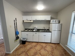 Fridge, microwave, stovetop, coffee/tea maker