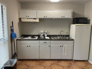 Fridge, microwave, stovetop, coffee/tea maker
