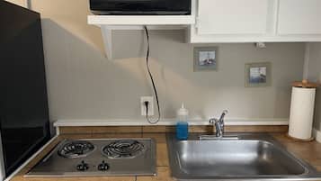 Microwave, stovetop, coffee/tea maker, cookware/dishes/utensils