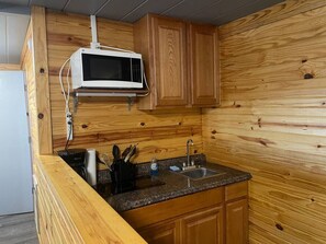 Fridge, microwave, stovetop, coffee/tea maker