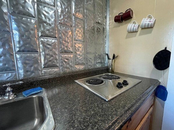 Microwave, stovetop, coffee/tea maker, cookware/dishes/utensils