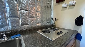 Microwave, stovetop, coffee/tea maker, cookware/dishes/utensils
