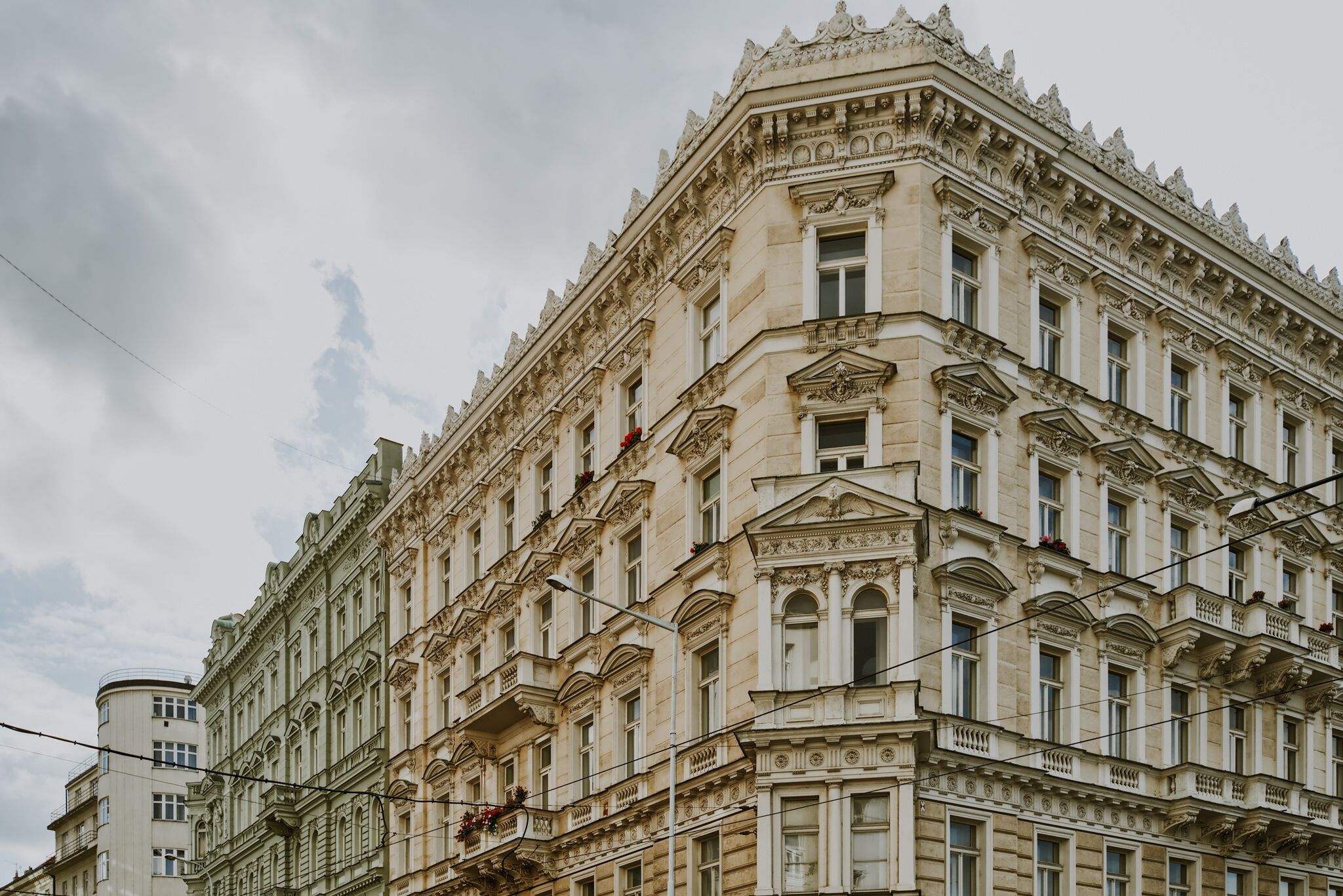 A historic building with ornate architectural details, large windows, and balconies.