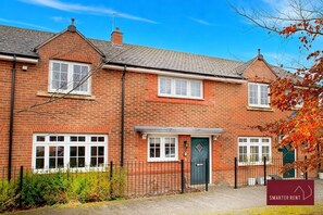 A two-story brick house with a front door, windows, and a small porch. - Bracknell, 2 Bedroom House, Garden & Parking (Bracknell)