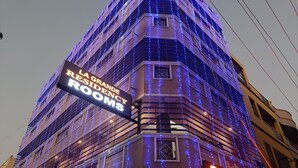 A building with a sign reading "La Grande Residency Rooms". - La Grande Residency (Puducherry)