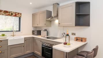 Fridge, electric kettle, toaster, cookware/dishes/utensils